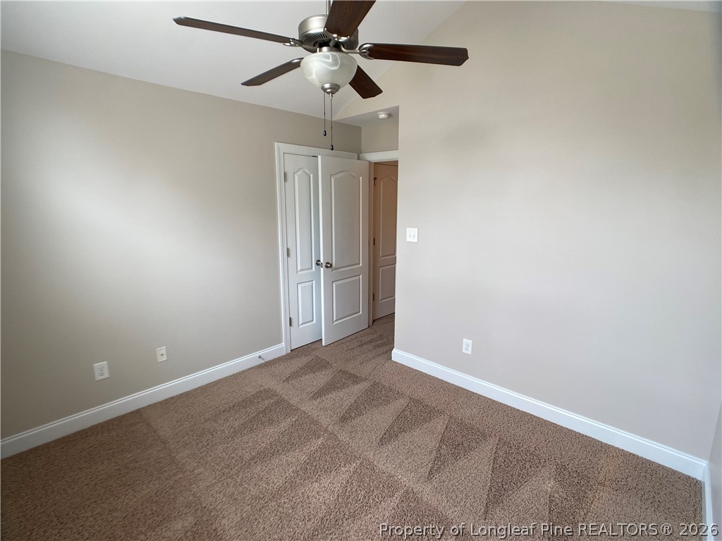 56 Orchard Falls Drive Spring Lake, NC 28390 - Photo 19 of 24 an empty room with a fan and a fan