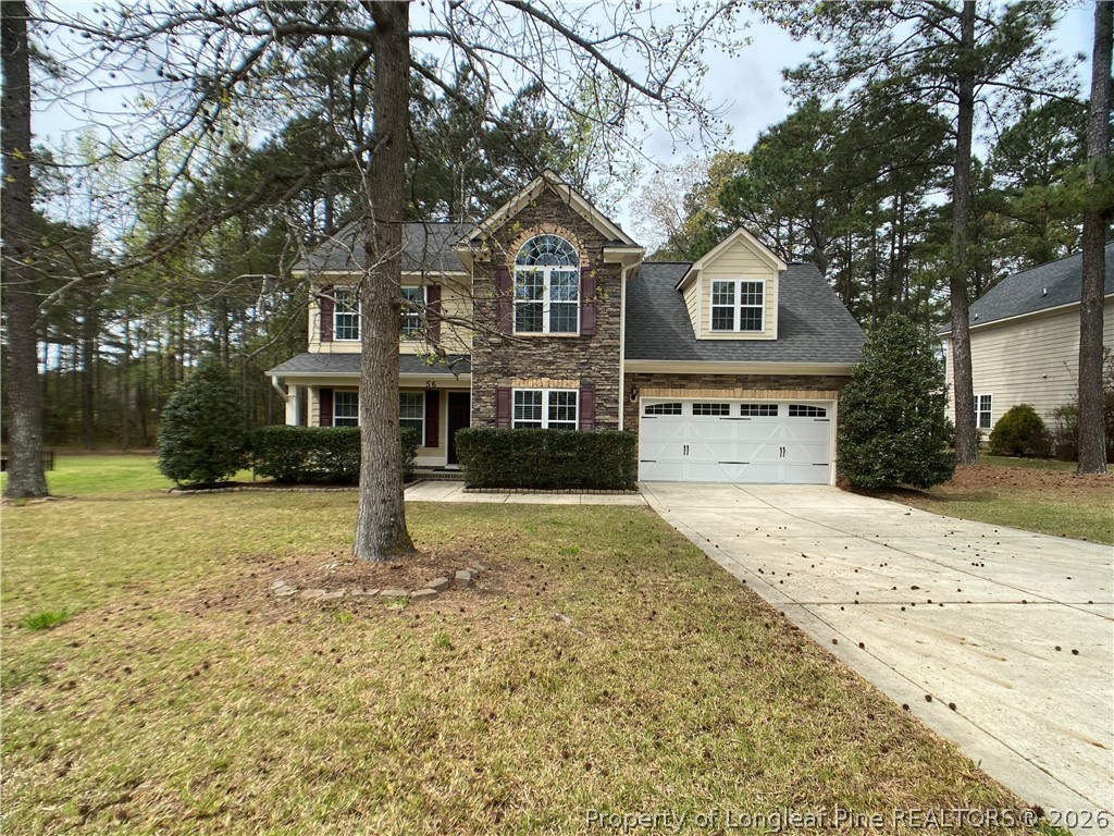 56 Orchard Falls Drive Spring Lake, NC 28390 - Photo 2 of 24 a front view of a house with a yard
