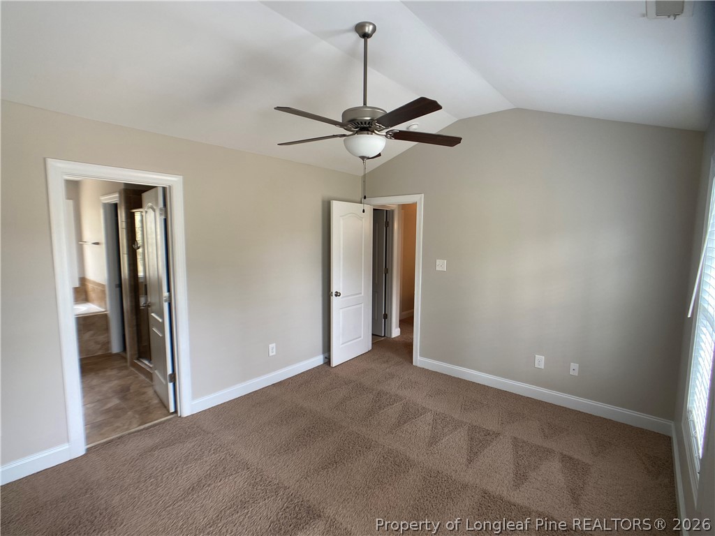 56 Orchard Falls Drive Spring Lake, NC 28390 - Photo 21 of 24 a view of an empty room and a ceiling fan