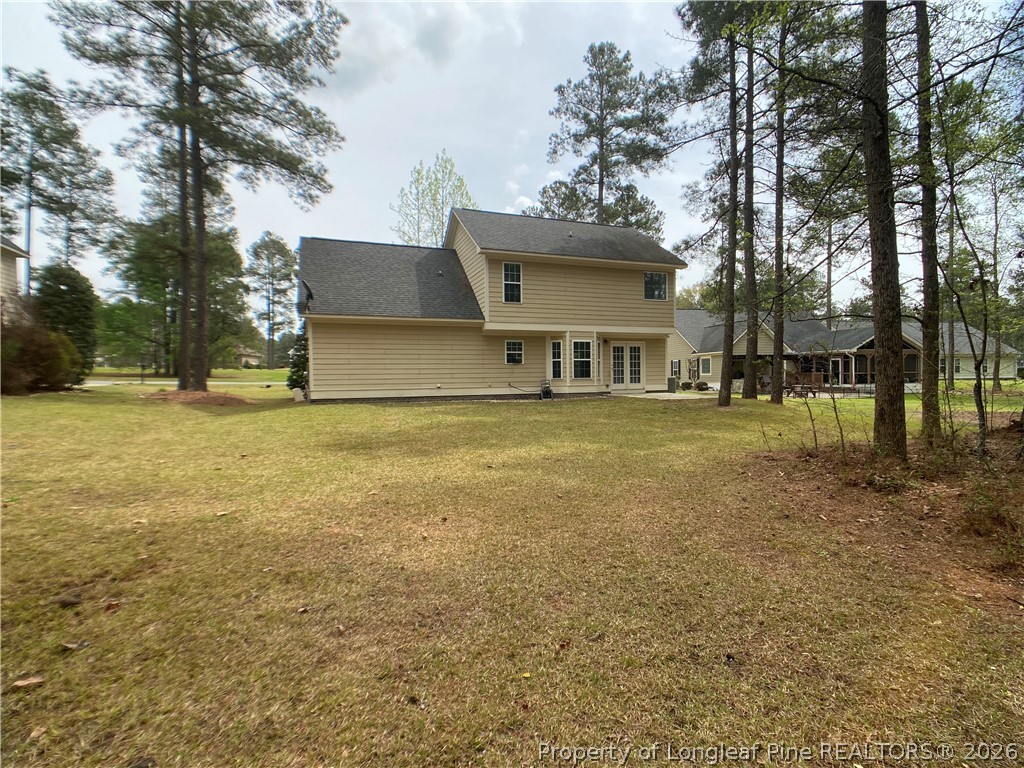 56 Orchard Falls Drive Spring Lake, NC 28390 - Photo 24 of 24 a view of a house with a yard and sitting area