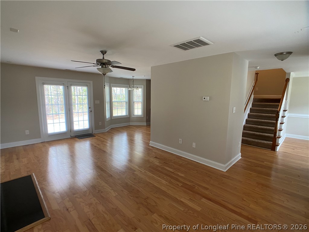 56 Orchard Falls Drive Spring Lake, NC 28390 - Photo 6 of 24 wooden floor in an empty room with a window