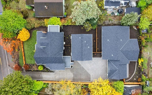 an aerial view of a house with yard swimming pool and outdoor seating