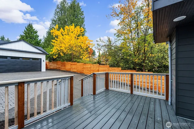 a balcony of view with wooden floor and fence