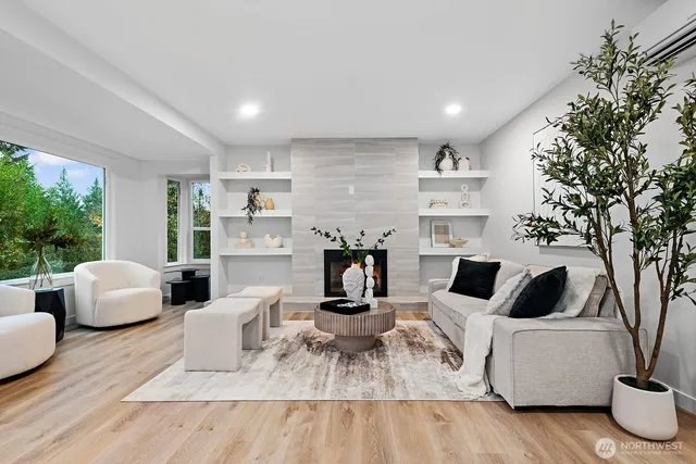 a living room with furniture and a large window