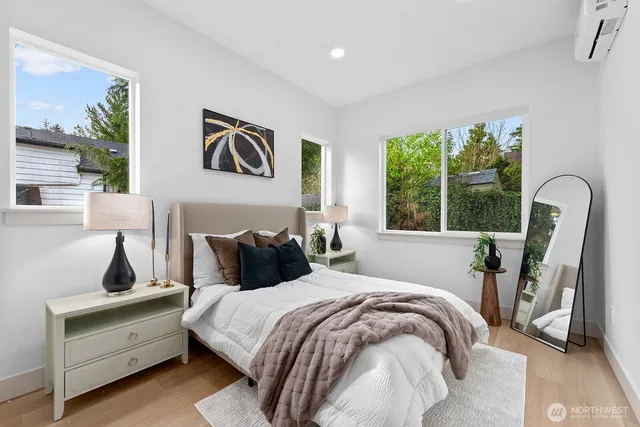 a bedroom with bed and a window