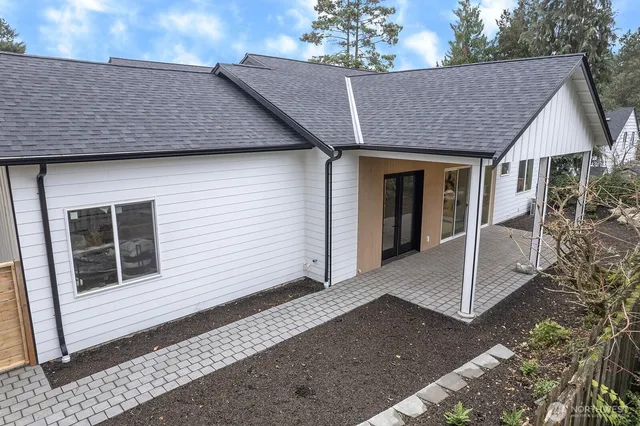 a house with trees in the background