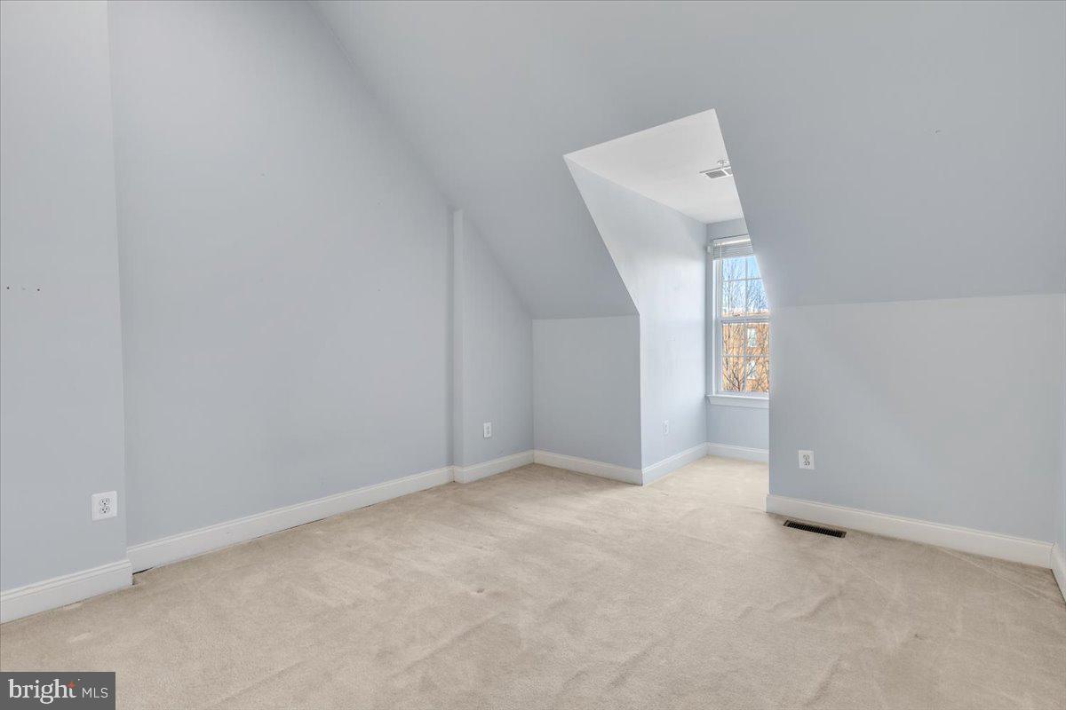 174 A Chevy Chase Street, Unit 174A Gaithersburg, MD 20878 - Photo 11 of 34 a view of an empty room with a window