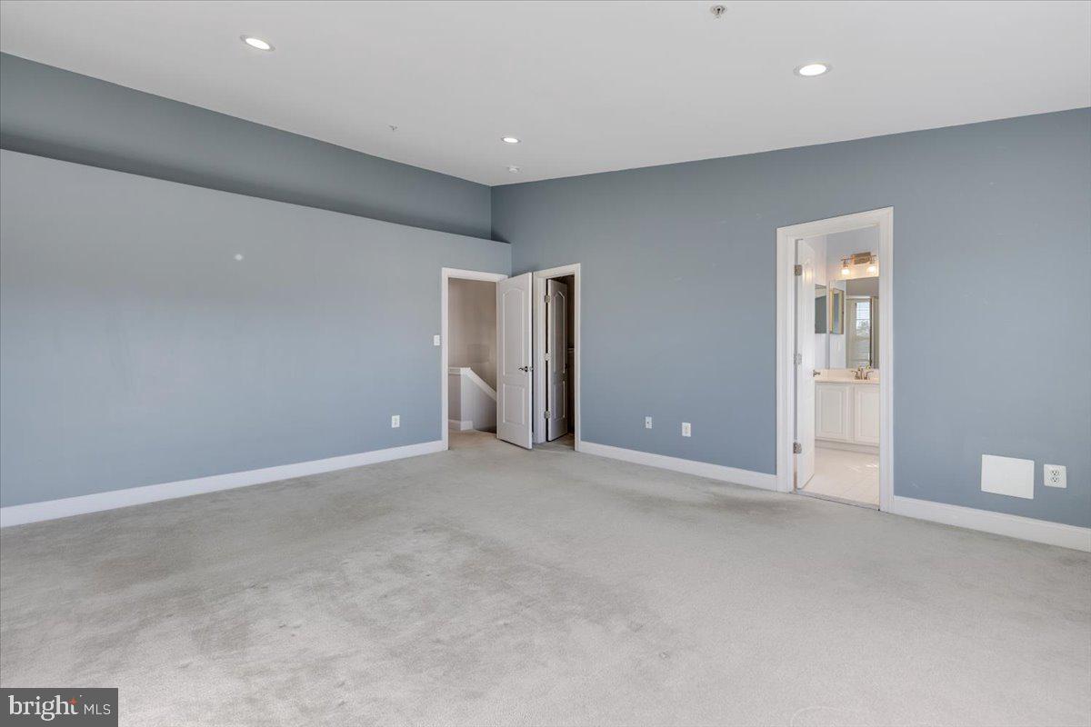 174 A Chevy Chase Street, Unit 174A Gaithersburg, MD 20878 - Photo 16 of 34 an empty room with closet and a toilet