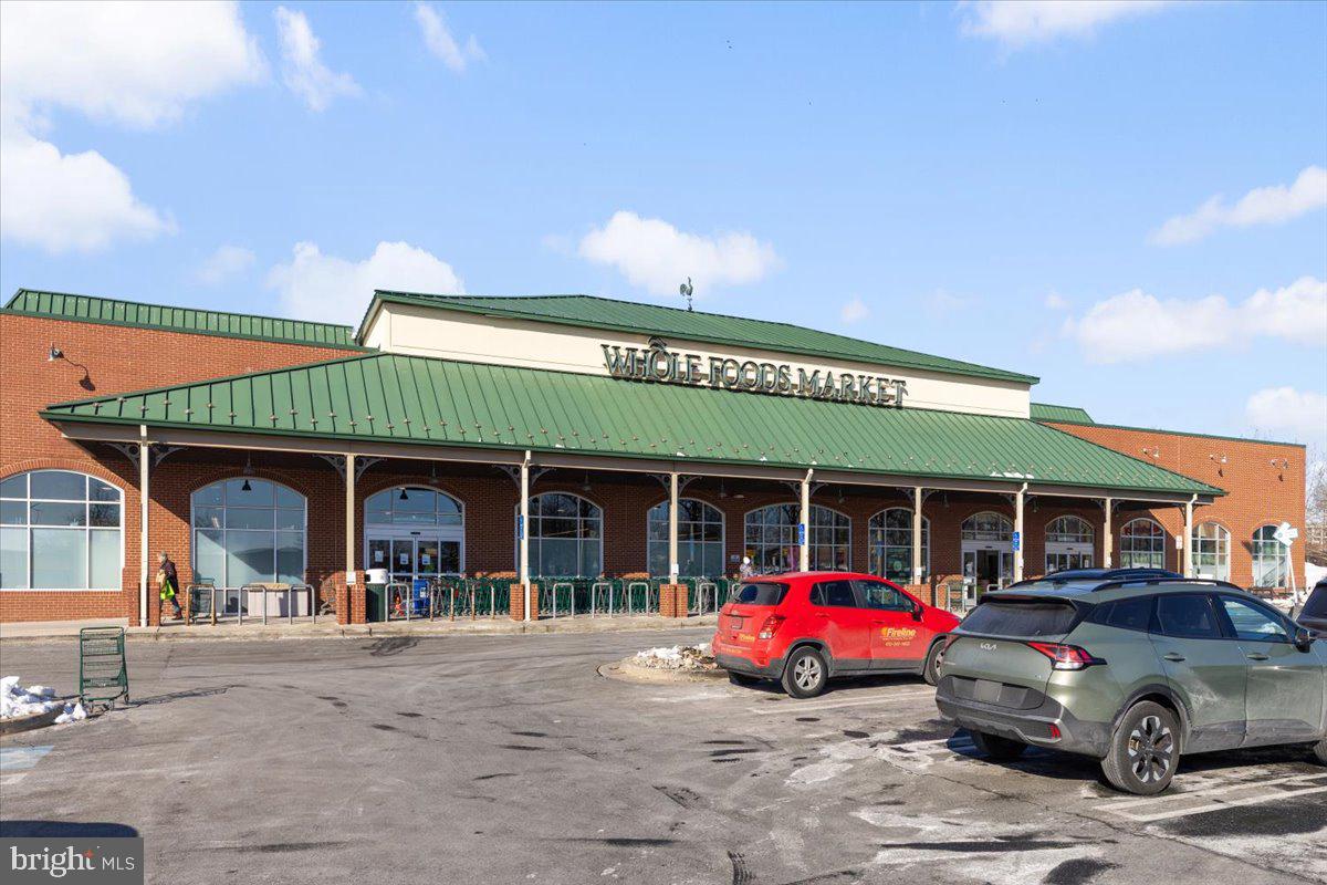 174 A Chevy Chase Street, Unit 174A Gaithersburg, MD 20878 - Photo 23 of 34 a view of a car park in front of house