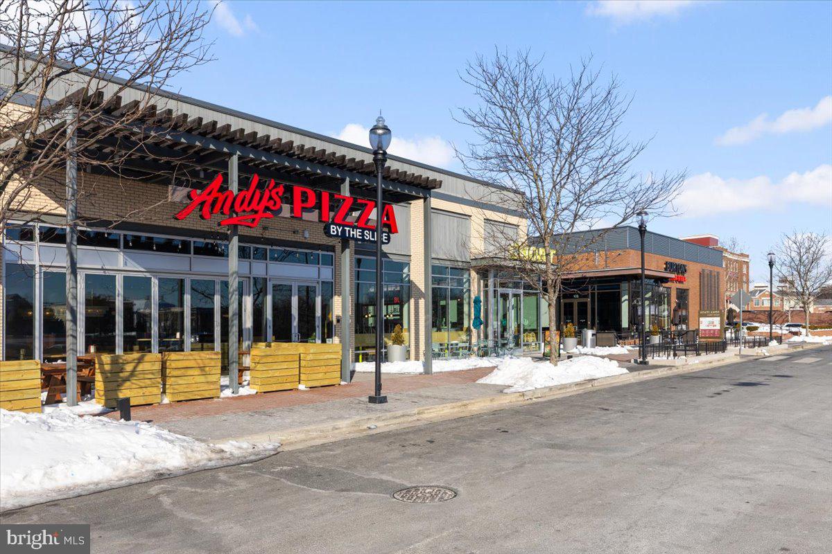 174 A Chevy Chase Street, Unit 174A Gaithersburg, MD 20878 - Photo 24 of 34 a view of a cafe with a table and chairs in patio