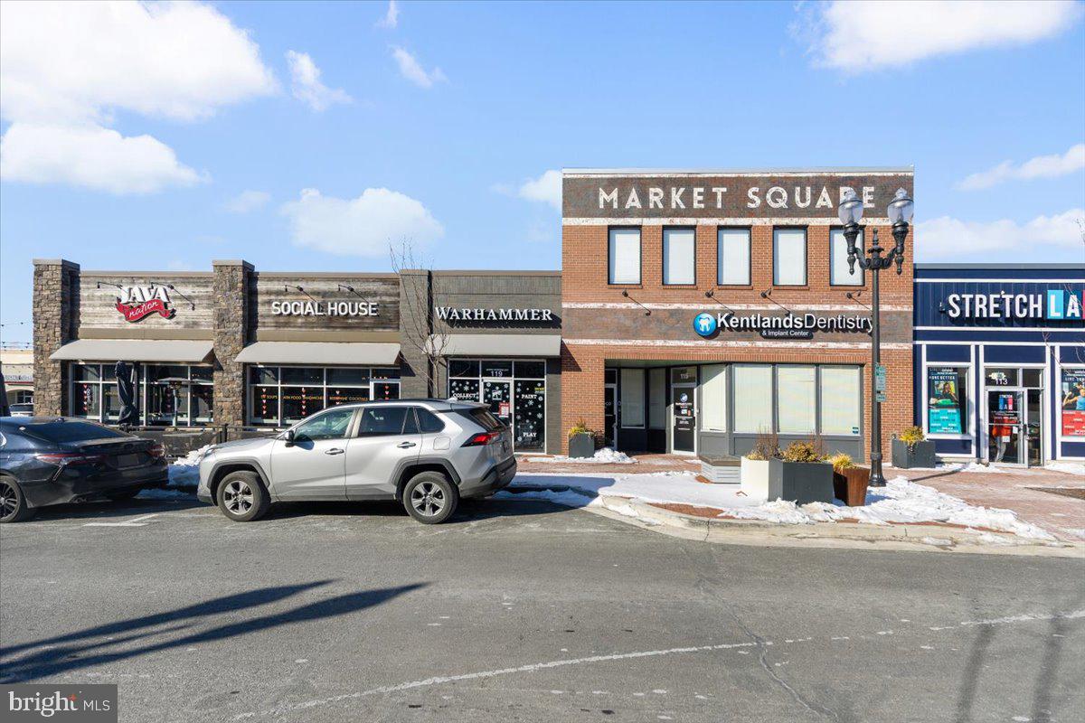 174 A Chevy Chase Street, Unit 174A Gaithersburg, MD 20878 - Photo 25 of 34 a view of a cars park in front of a building