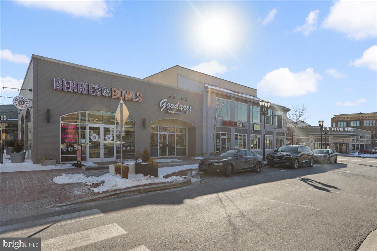 174 A Chevy Chase Street, Unit 174A Gaithersburg, MD 20878 - Photo 29 of 34 a city street lined with buildings and cars