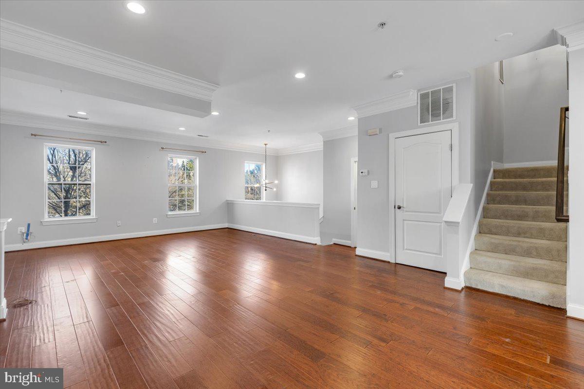 174 A Chevy Chase Street, Unit 174A Gaithersburg, MD 20878 - Photo 3 of 34 a view of empty room with wooden floor and window