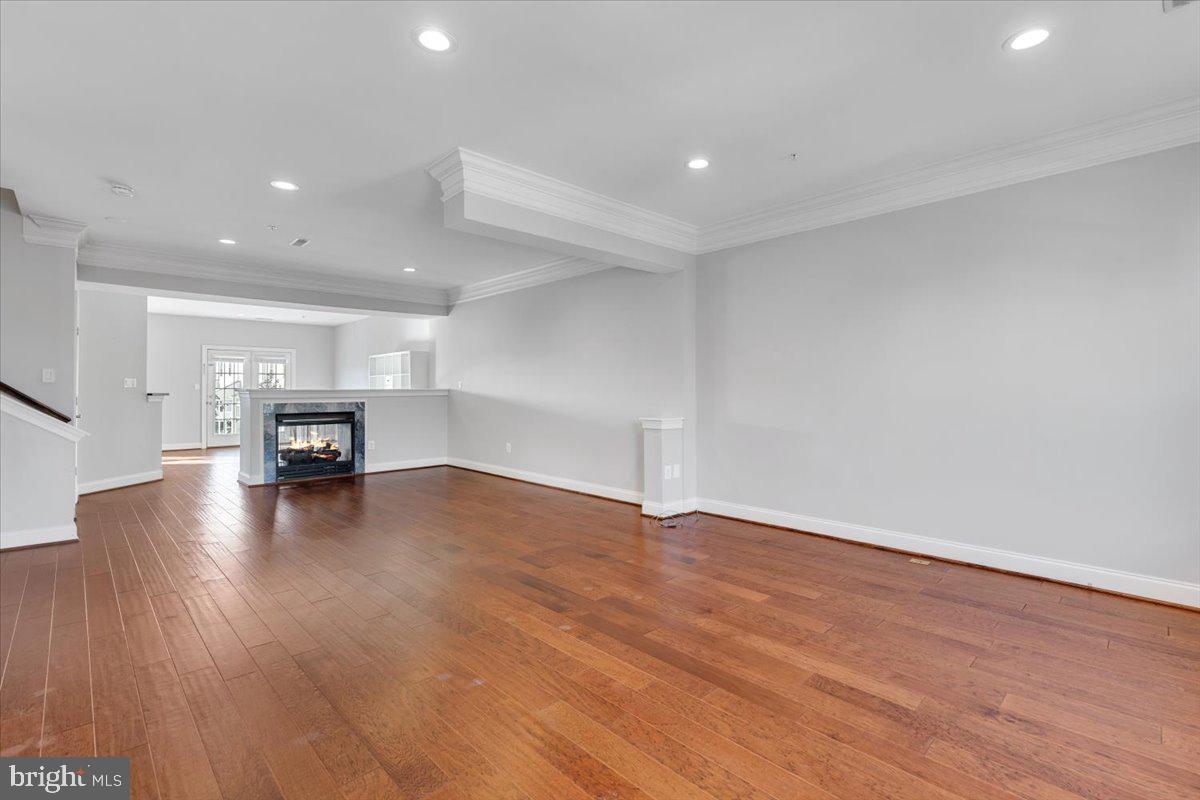 174 A Chevy Chase Street, Unit 174A Gaithersburg, MD 20878 - Photo 4 of 34 a view of empty room with wooden floor