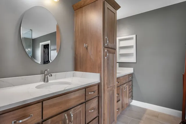 an empty room with a ceiling fan and a window