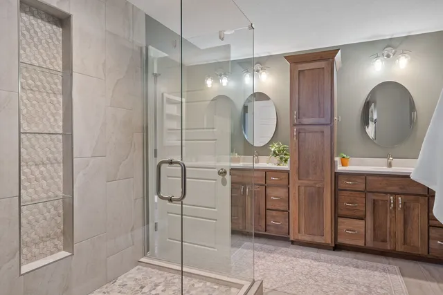 a room with furniture a air conditioner vent and a window