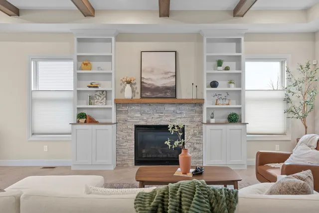 a living room with furniture and a fireplace