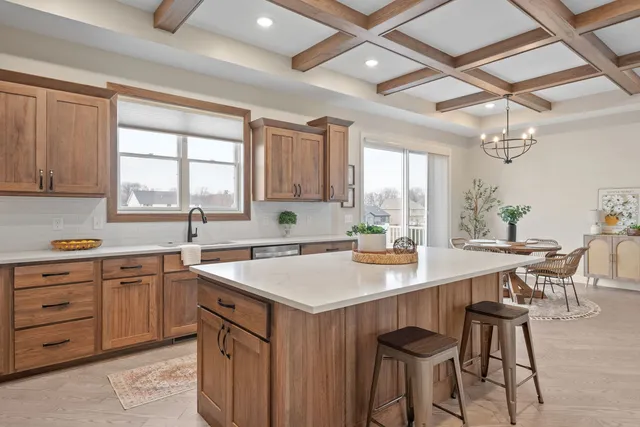 a kitchen with stainless steel appliances granite countertop a stove and a refrigerator