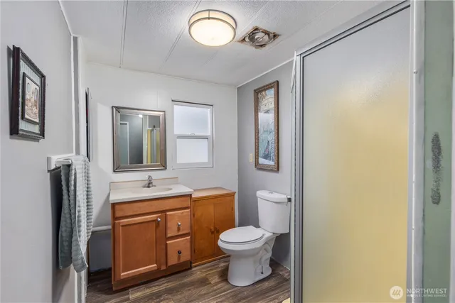 a view of a bathroom from a hallway