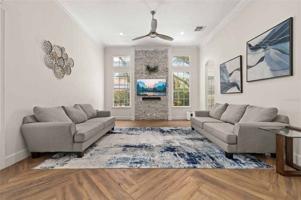 8351 Bowden Way Windermere, FL 34786 - Photo 17 of 71 a living room with furniture and a fireplace