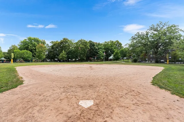 swimming pool view with a bench