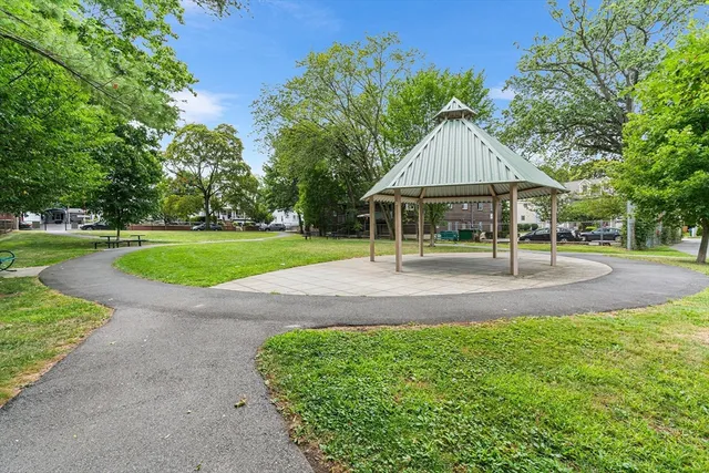 a picture of a bench in front of a wall
