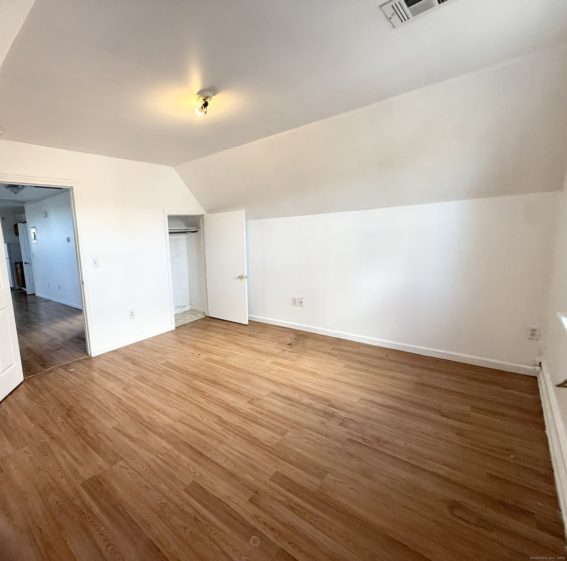 342 Exchange Street New Haven, CT 06513 - Photo 2 of 9 a view of empty room with wooden floor