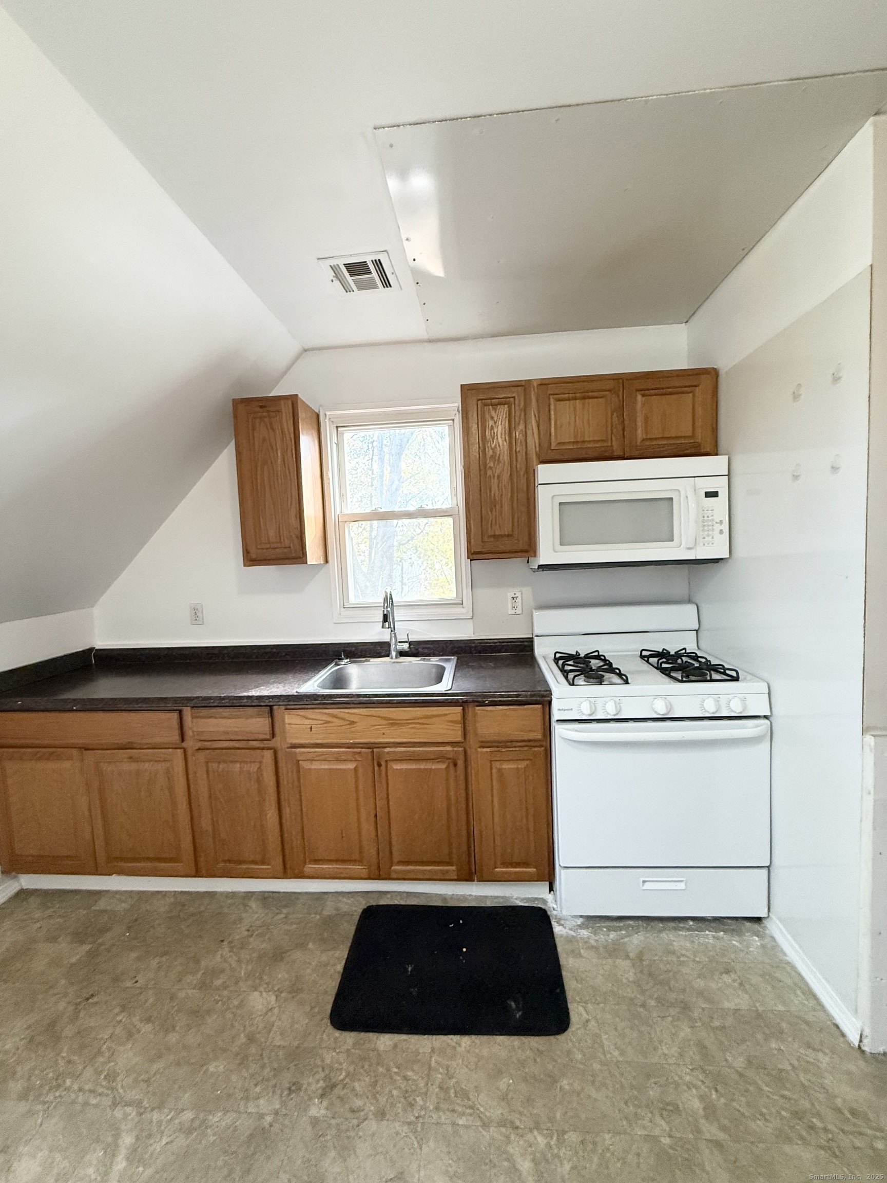 342 Exchange Street New Haven, CT 06513 - Photo 4 of 9 a kitchen with stainless steel appliances a stove a sink and a refrigerator