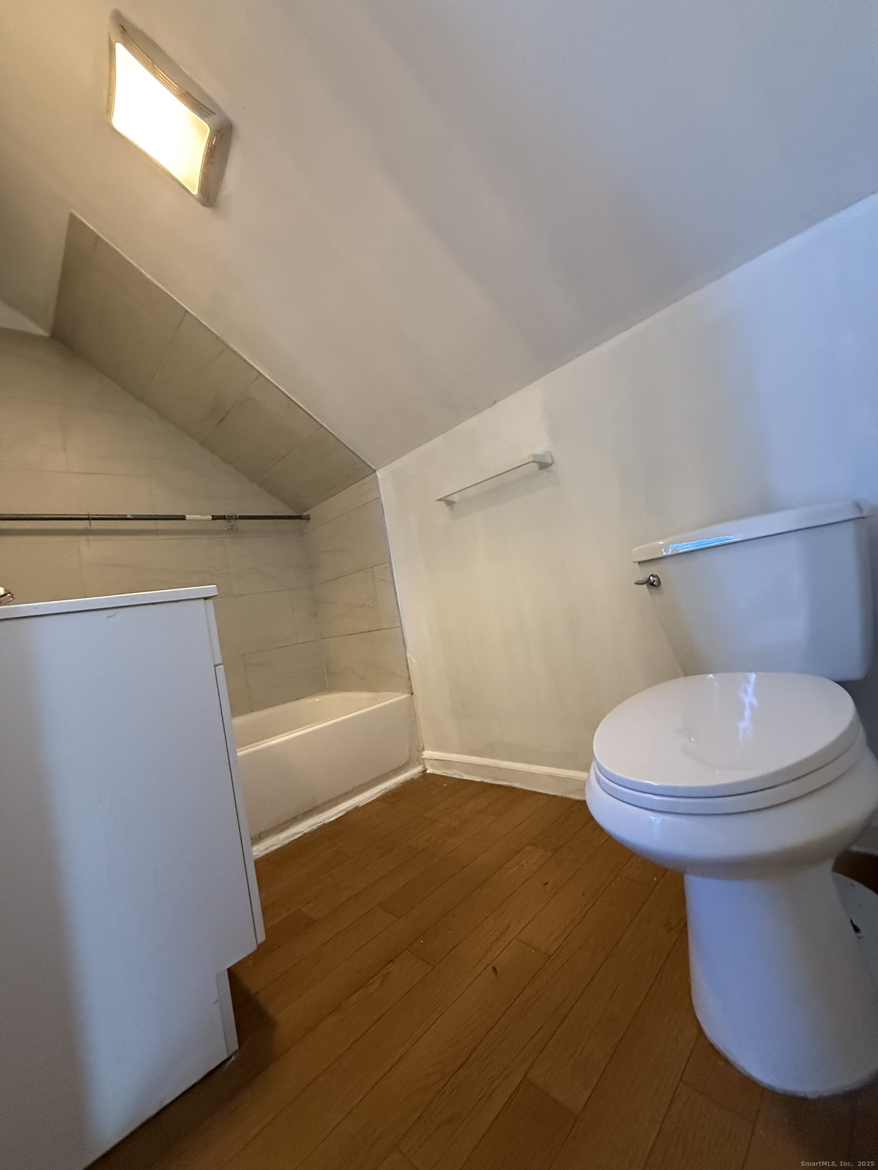 342 Exchange Street New Haven, CT 06513 - Photo 5 of 9 a bathroom with a white toilet and tub