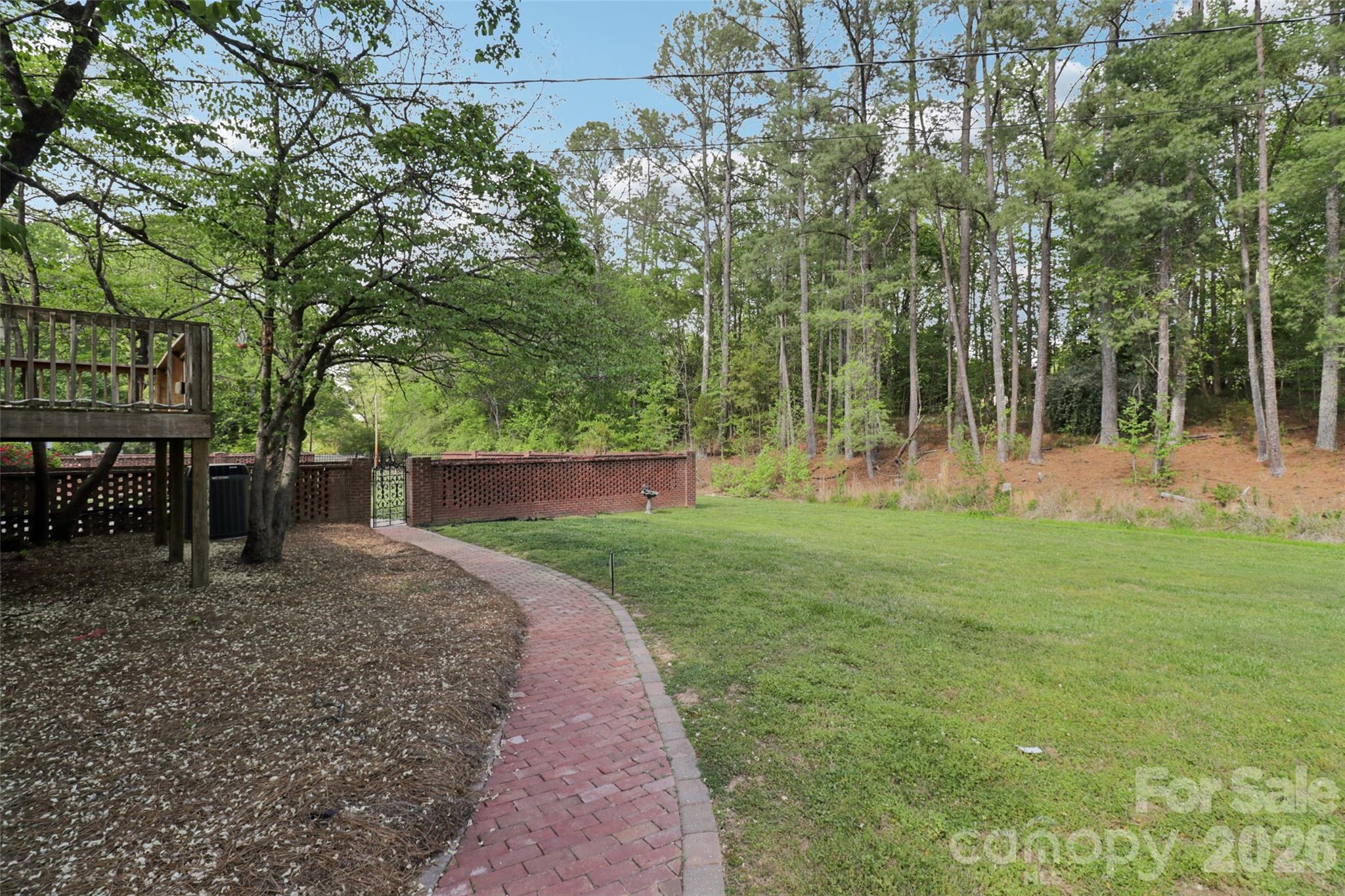 1002 Ridge Street Albemarle, NC 28001 - Photo 40 of 45 a view of a backyard with a garden