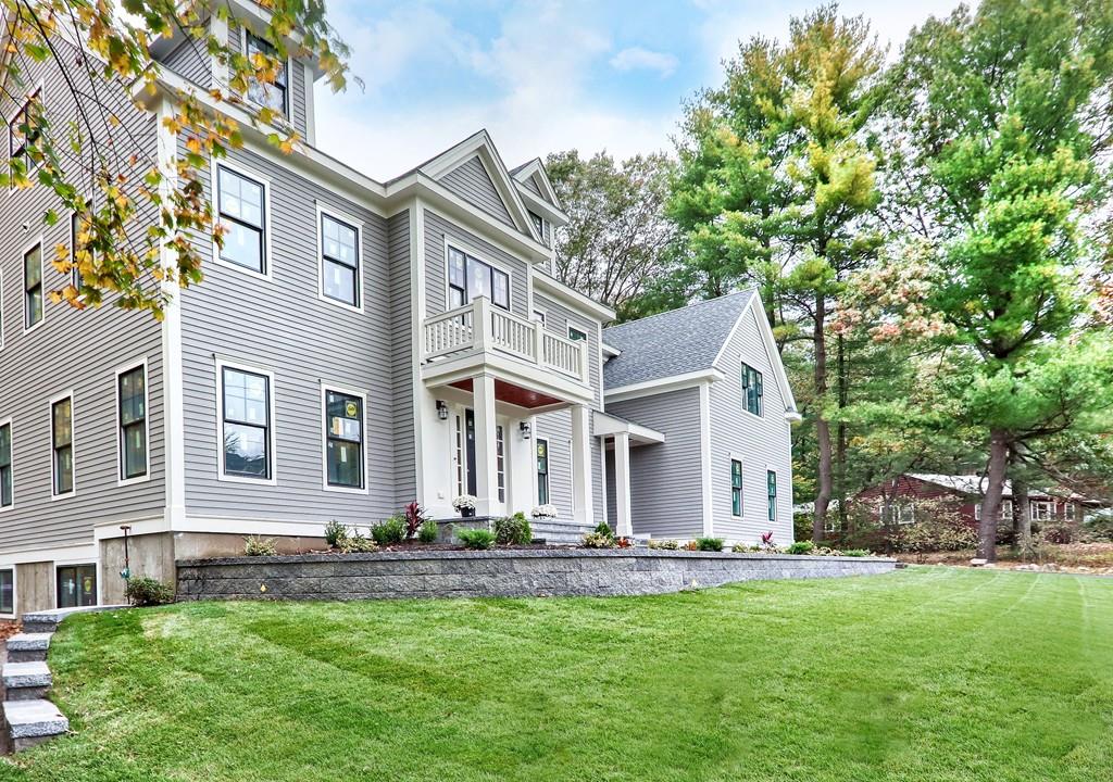12 Bates Road Lexington, MA 02421 - Photo 2 of 6 a front view of house with yard and green space