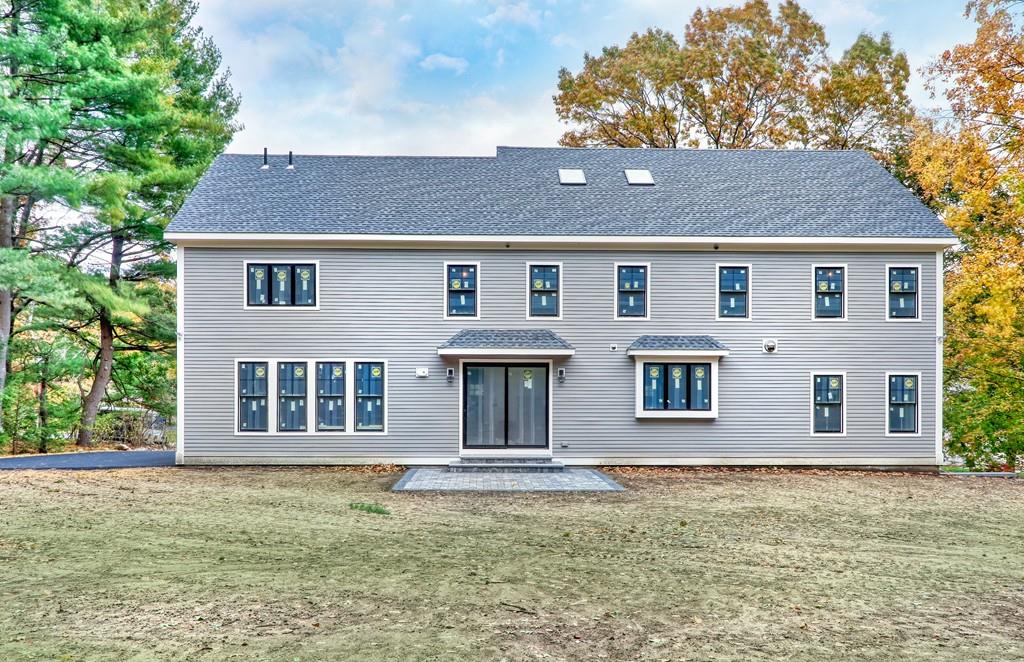 12 Bates Road Lexington, MA 02421 - Photo 4 of 6 a front view of a house with garden