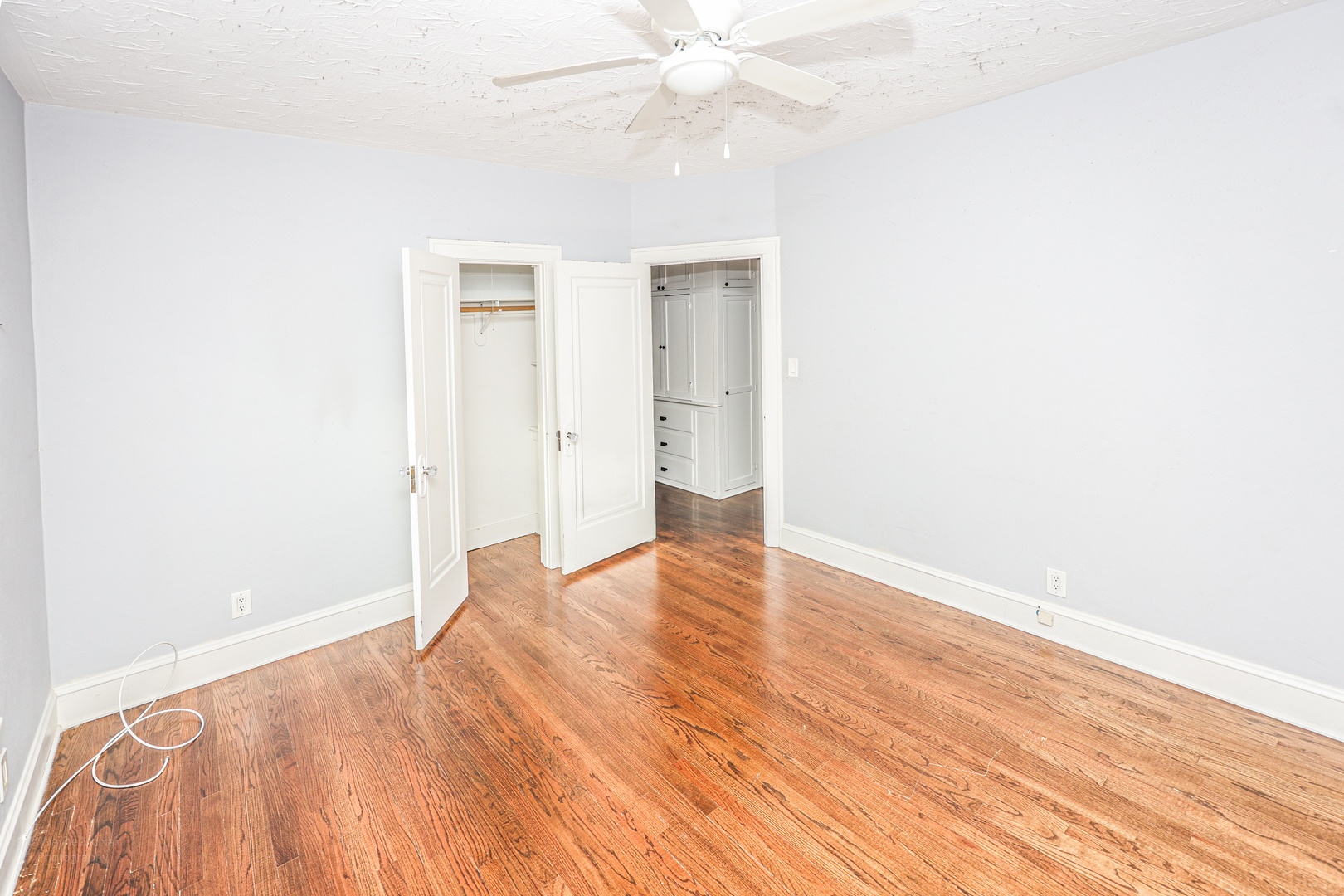 815 Mason Avenue, Unit 2 Joliet, IL 60435 - Photo 4 of 13 a view of an empty room with wooden floor