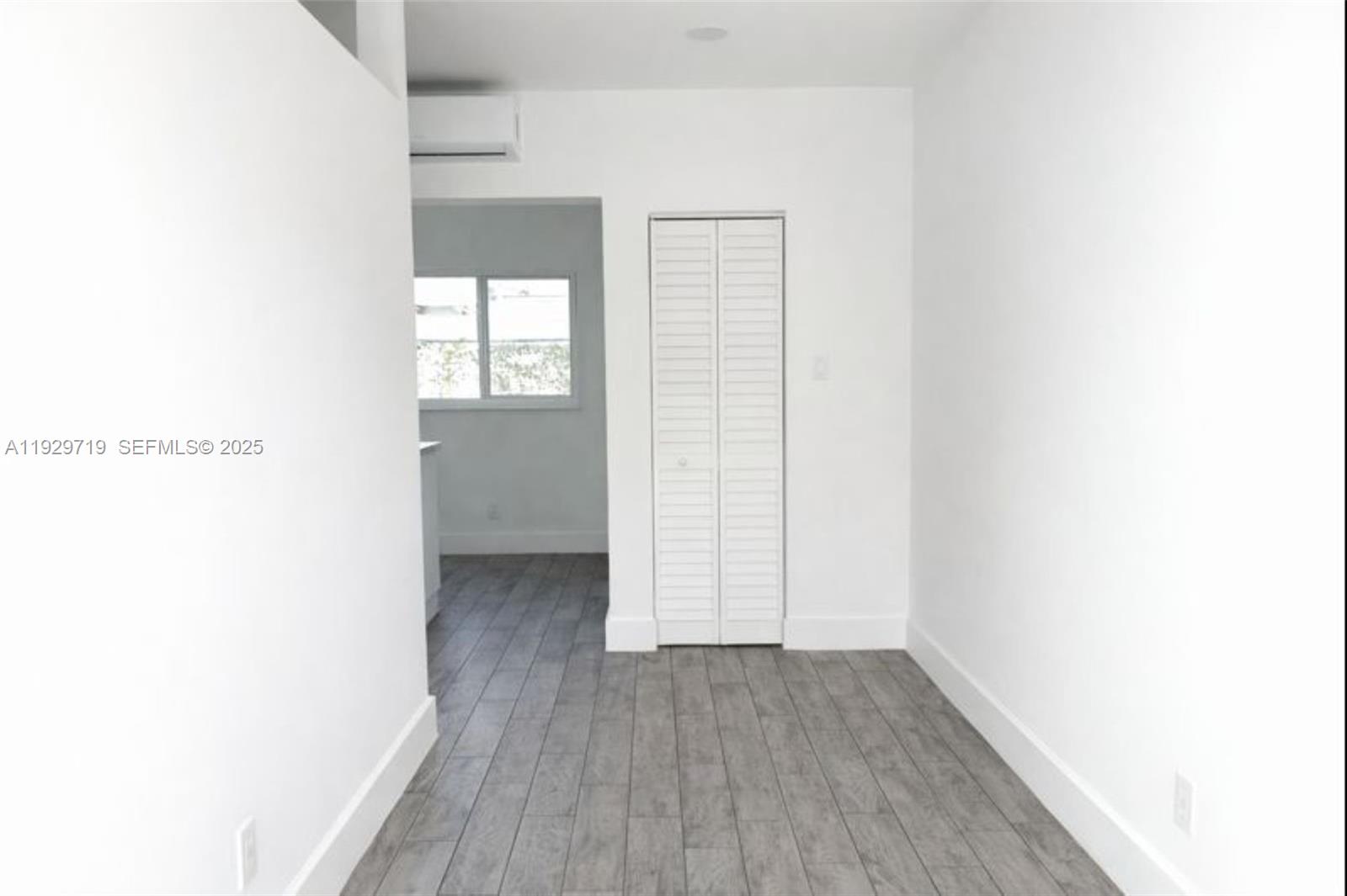 3071 Southwest 27th Lane, Unit 3 Miami, FL 33133 - Photo 2 of 7 a view of a room with wooden floor