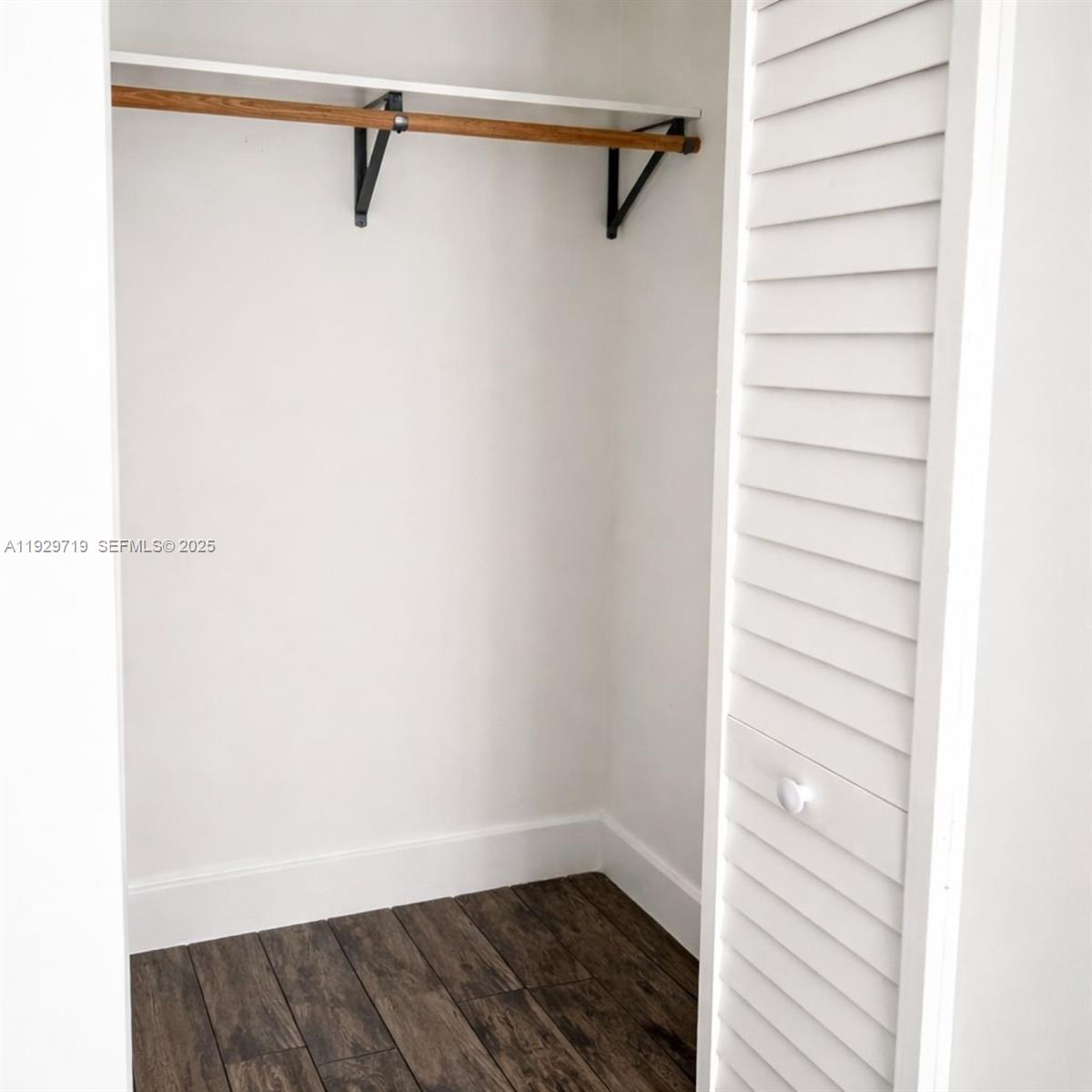 3071 Southwest 27th Lane, Unit 3 Miami, FL 33133 - Photo 7 of 7 a view of a room with racks on the wall