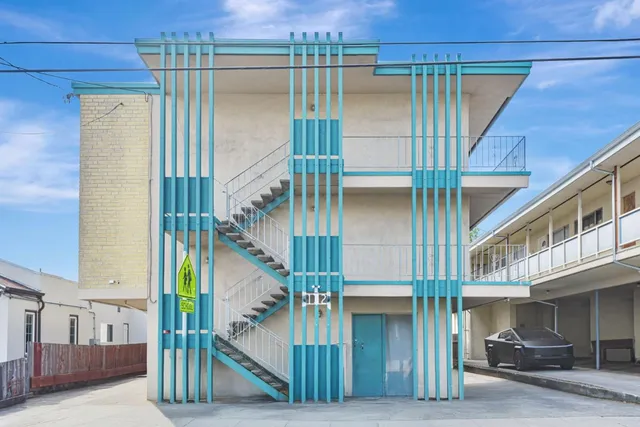 a view of a house with a door and wooden floor