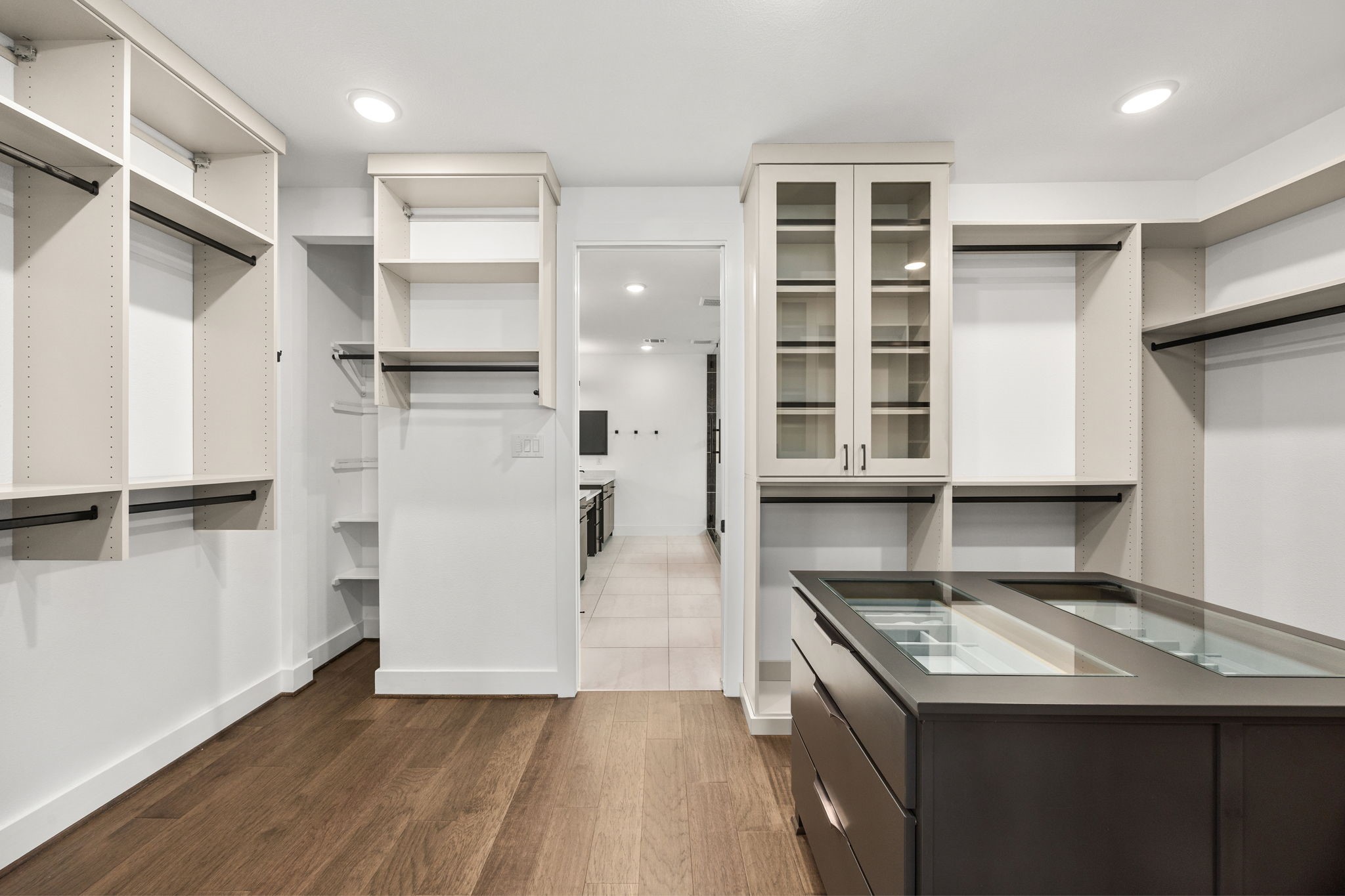 424 Redan Street Houston, TX 77009 - Photo 27 of 47 Luxurious walk-in closet featuring a stylish built-in island for ultimate organization.