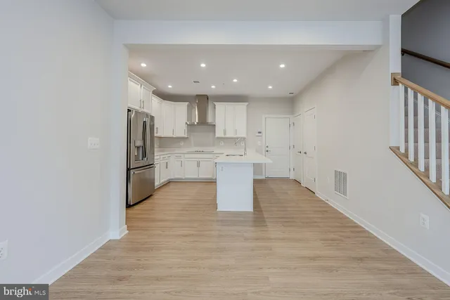a view of a balcony with wooden floor and furniture