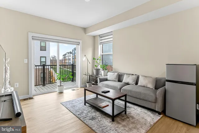 a view of a balcony with wooden floor and furniture