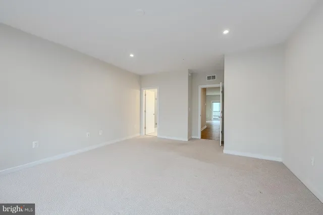 a view of a hallway with washer and dryer