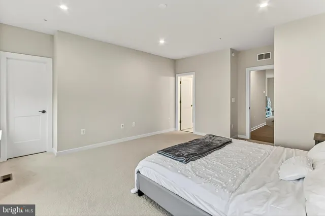 a bathroom with a glass shower door