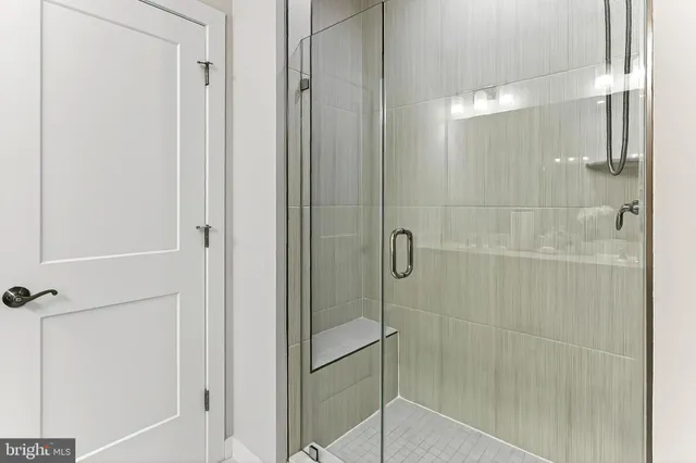 a bedroom with a bed and a table