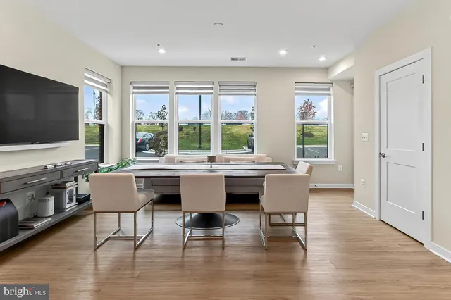 a workspace with furniture hardwood and a window