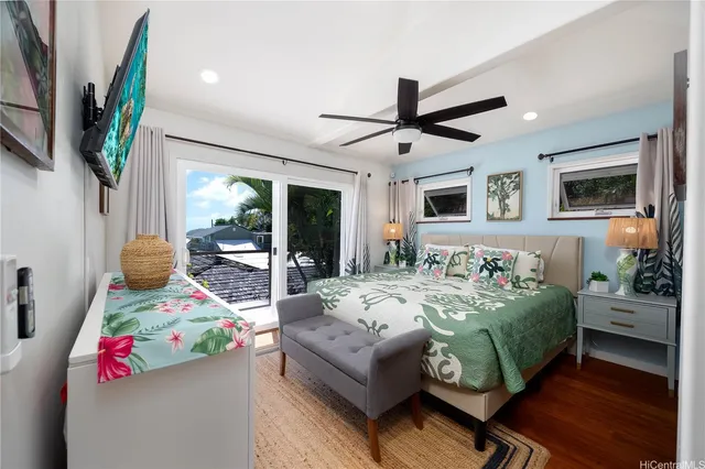 a bedroom with a bed couch and a window