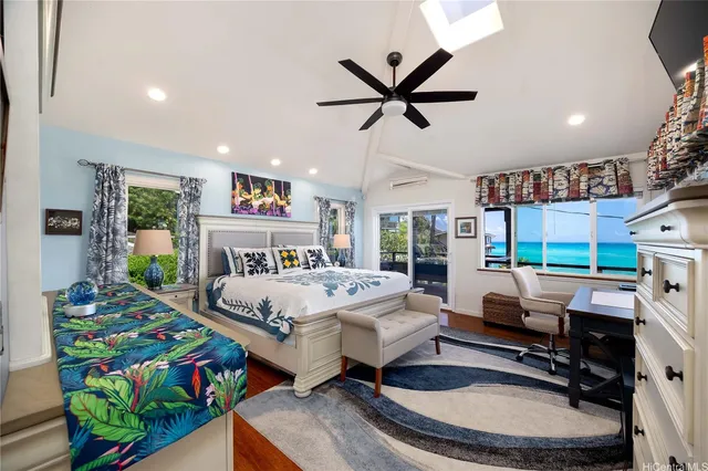 a bed room with furniture and a flat screen tv