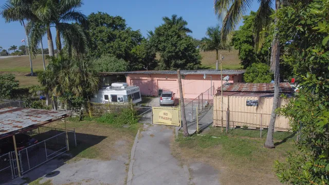 a view of a backyard with furniture and a tub