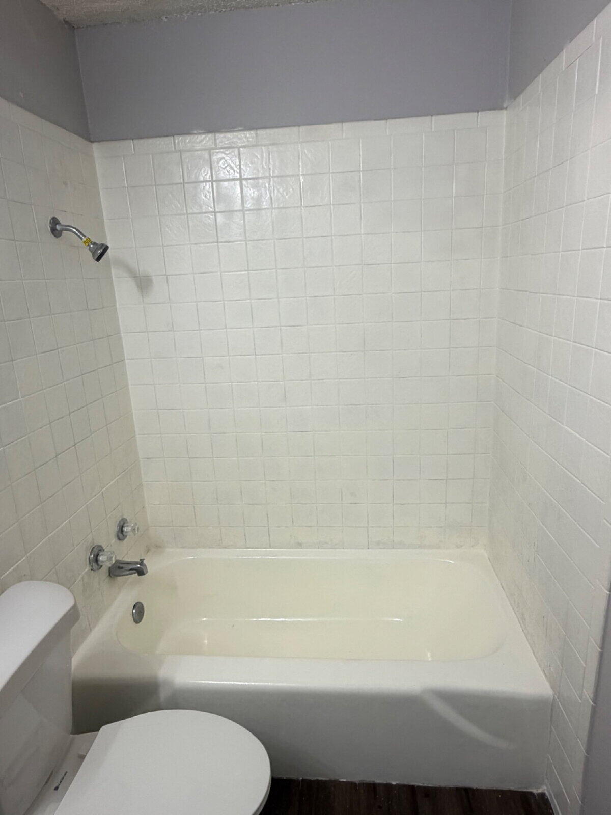 3211 35th Street, Unit A Lubbock, TX 79413 - Photo 11 of 16 a bathroom with a toilet and a bathtub