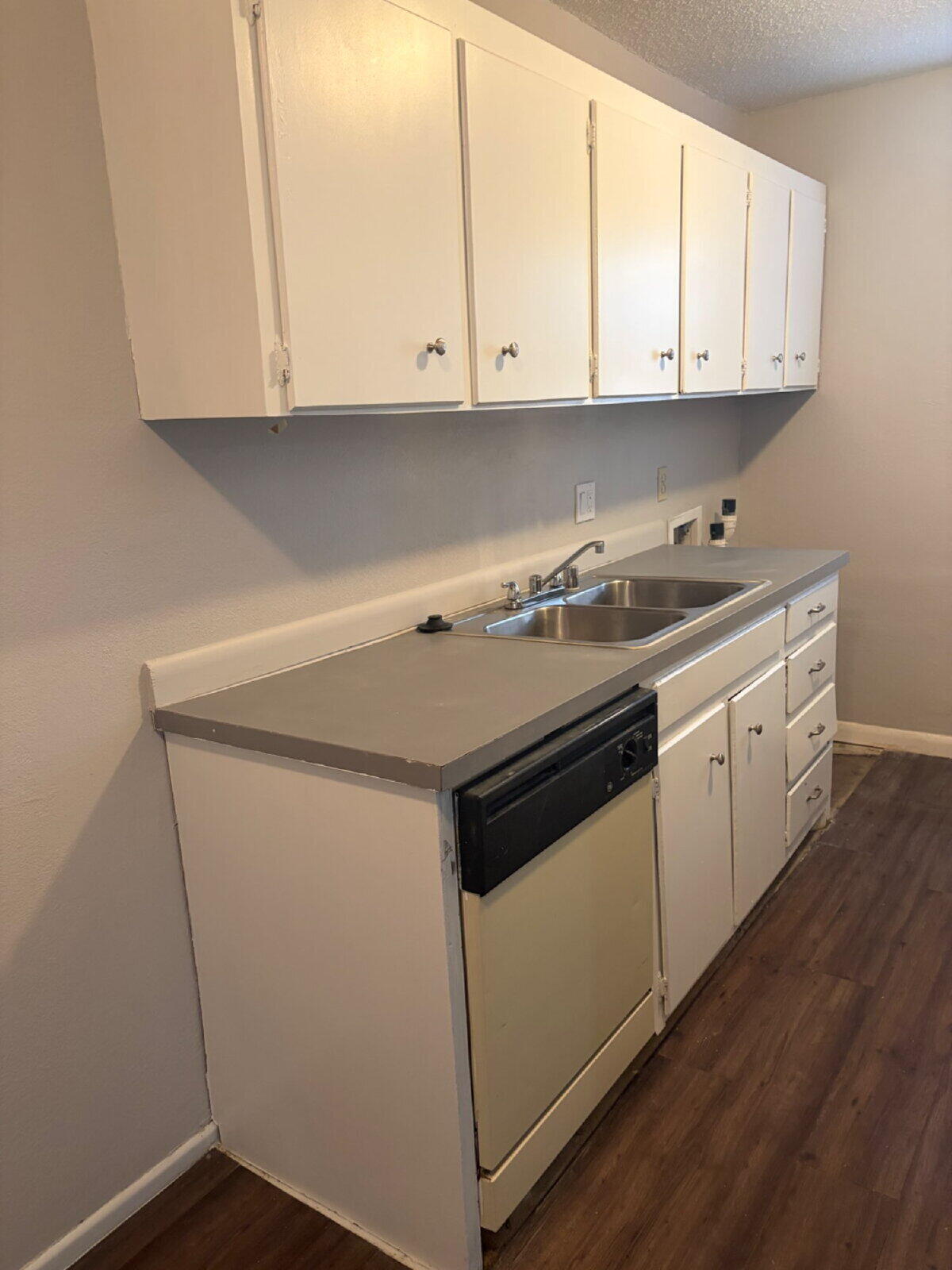 3211 35th Street, Unit A Lubbock, TX 79413 - Photo 6 of 16 a kitchen with granite countertop white cabinets and a stove