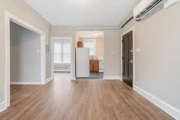 a view of a livingroom with wooden floor