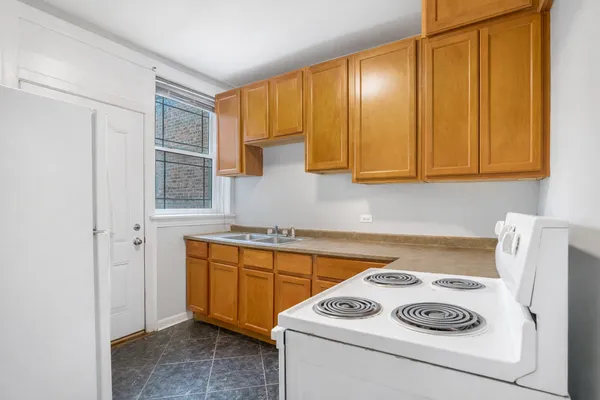a kitchen with a stove and a cabinet